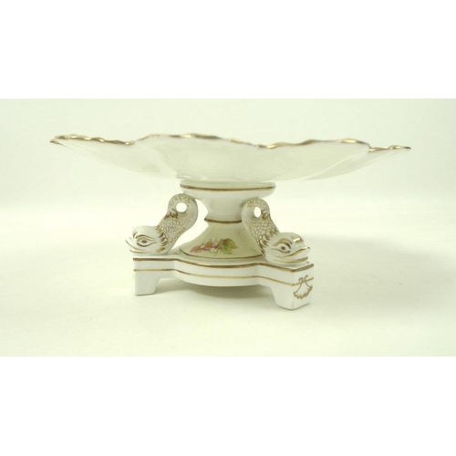 539 - An early 20th century dessert service, possible Limoges, three comports with dolphin bases, moulded ... 