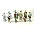 A group of nine porcelain and china figurines, comprising a Meissen figurine, late 19th century, mod... 