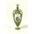 A late Victorian Royal Crown Derby porcelain twin handled vase with flared rim and circular pedestal... 