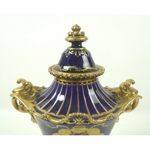 560 - A late Victorian Royal Crown Derby porcelain twin handled pedestal vase and cover, decorated in gilt... 