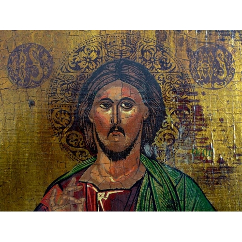 561 - A Greek Orthodox icon, late 19th or early 20th century, depicting Jesus holding a book, green title ... 