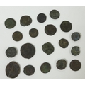 A collection of Roman coins spanning several centuries of the Roman Empire, including Constantine an... 