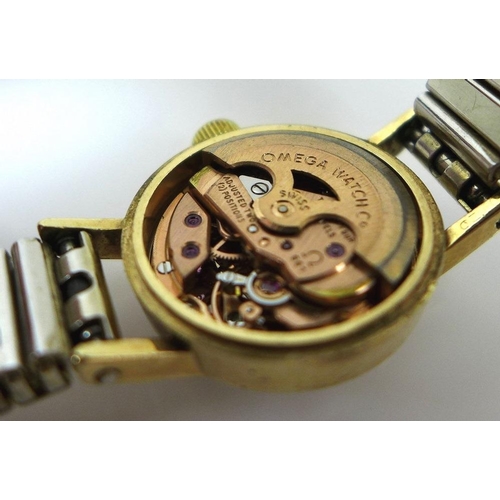 816 - An Omega 9ct gold cased Ladymatic wristwatch, circular dial with gold batons and black hands, cal 66... 