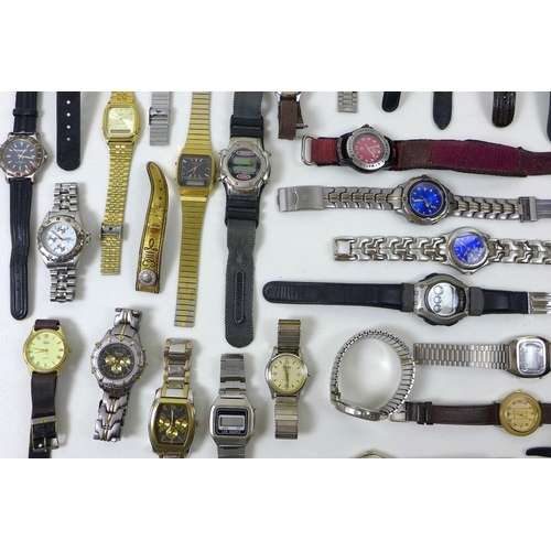 820 - A collection of costume and fashion watches, mostly gentlemen's, including Wrangler, New Swiss Army ... 