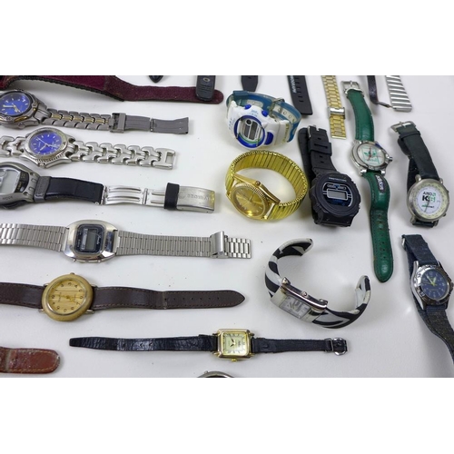 820 - A collection of costume and fashion watches, mostly gentlemen's, including Wrangler, New Swiss Army ... 