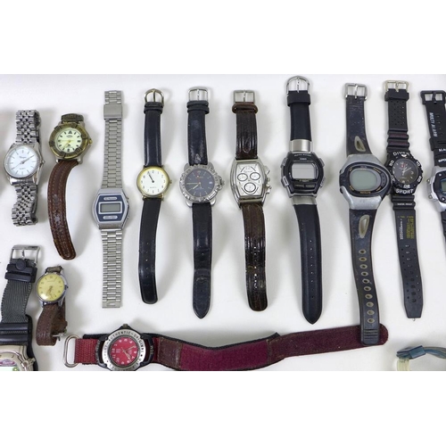 820 - A collection of costume and fashion watches, mostly gentlemen's, including Wrangler, New Swiss Army ... 