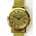 A lady's Jaeger Le Coultre 18ct gold wristwatch with 9ct gold bracelet strap, circular gold dial wit... 