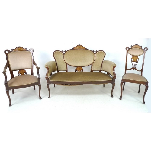 945 - An Edwardian parlour part suite of chairs, marquetry inlaid with floral crests, comprising an open a... 