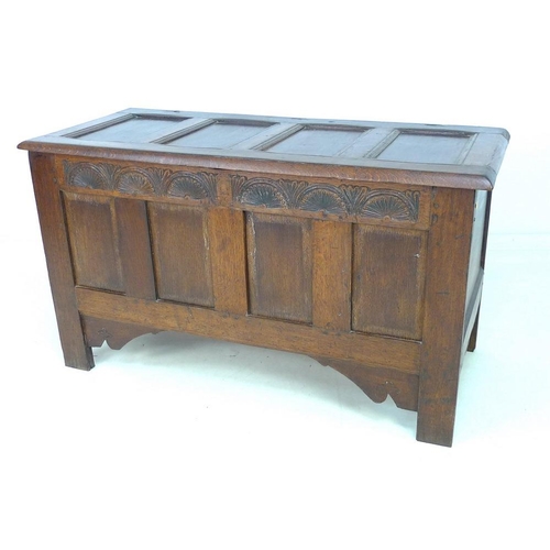 946 - A 17th century oak coffer with candle box and carved demi-lunettes to the four panel front, panel to... 