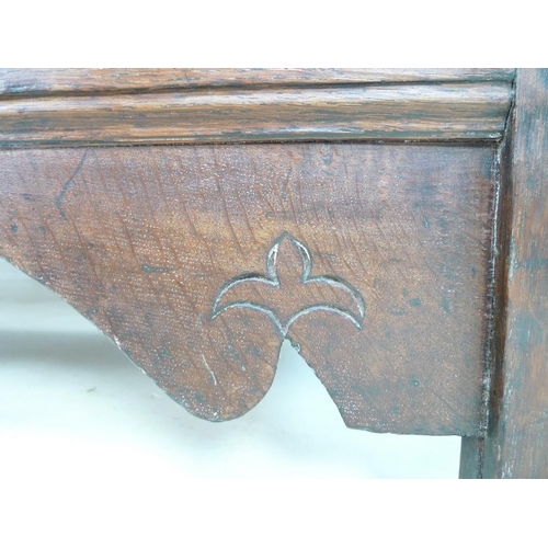 946 - A 17th century oak coffer with candle box and carved demi-lunettes to the four panel front, panel to... 