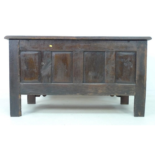 946 - A 17th century oak coffer with candle box and carved demi-lunettes to the four panel front, panel to... 