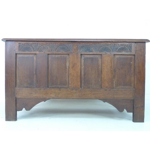 946 - A 17th century oak coffer with candle box and carved demi-lunettes to the four panel front, panel to... 