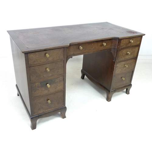 947 - A 19th century mahogany kneehole desk, nine drawers with brass pull handles, dark red leather skiver... 