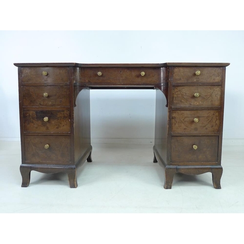 947 - A 19th century mahogany kneehole desk, nine drawers with brass pull handles, dark red leather skiver... 