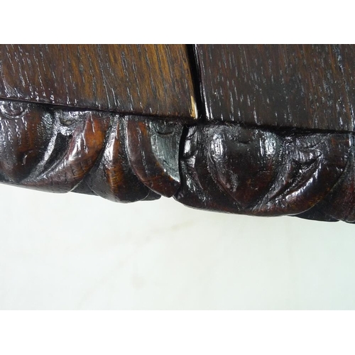 948 - A large 18th century and later oak drop leaf dining table, with egg and dart carved edge to the oval... 