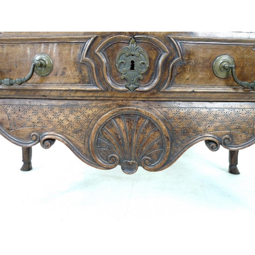 949 - A French Louis XV walnut commode of arc en arbalet outline, mid 18th century, moulded surface over t... 