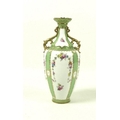 A late Victorian Royal Crown Derby porcelain twin handled vase with flared rim, decorated with flora... 