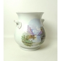 A late 19th century Continental ceramic jar, of bellied form with twin handles, missing lid, decorat... 
