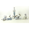 A group of three Lladro clown figurines comprising The Magic of Comedy, 6913, Clown in Love, 6997, a... 