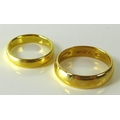 Two 22ct gold rings, both bands hallmarked, one size K, the other size F, 8.1g total. (2)