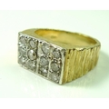 A gentleman's 18ct gold and diamond ring, the twelve pave set brilliant cut diamonds totalling appro... 