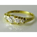 An 18ct gold and platinum five stone diamond ring, the central diamond approx 0.3cts, approximately ... 