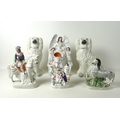 A collection of six 19th century Staffordshire pottery flatback figurines, comprising a pair of span... 