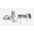 Two Lladro figurines of dogs, one a Great Dane, 1068, 30 by 17cm, the other a Basset Hound, 1066, 20... 