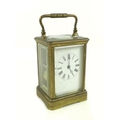 A late 19th or early 20th century French brass carriage clock, the white enamel dial with Roman nume... 