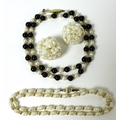 A pearl and onyx necklace, the alternating design interspersed with gold coloured beads, clasp marke... 