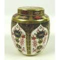 A Royal Crown Derby bone china ginger jar, Old Imari pattern, 1128, LXII, 11cm high.