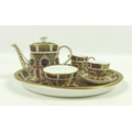 A Royal Crown Derby bone china miniature tea set, Old Imari pattern, 1128, comprising oval tray, 20 ... 
