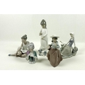 A collection of Lladro figures, including a seated girl with dove, model H13E, Nao, a girl with bask... 
