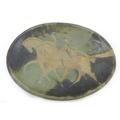 A studio pottery charger, of oval form decorated with pair of riders on horses, in the Etruscan styl... 