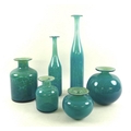 A set of M'dina glass, all in turquoise and of graduated sizes, comprising two globular vases, two b... 
