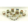 A collection of Royal Crown Derby bone china miniature figurines, comprising four houses, The China ... 