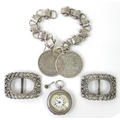 A pair of Edwardian paste shoe buckles, each 5 by 3.5cm, a lady's silver pocket watch, the white ena... 