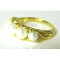 An 18ct gold and pearl ring, the five pearls of graduating size, largest central pearl approximately... 