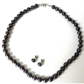 A South Seas black pearl necklace, comprising forty seven evenly sized cultured pearls, each of appr... 