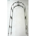 A modern metal garden rose arch, decorated with scroll detailing, 45 by 99 by 245cm high.