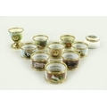 A collection of Graham Payne Studio ceramics, hand painted, comprising eight napkin rings, variously... 