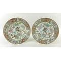 A pair of Canton Export porcelain enamelled plates, Qing Dynasty, late 19th century, the centre of e... 