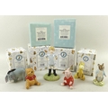 A collection of Winnie the Pooh figurines, comprising Doulton Christopher Robin, WP9, 13cm, a Beswic... 