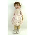 An early 20th century French bisque headed doll, with articulated limbs and closing eyes, inscribed ... 