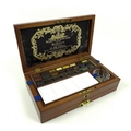A Victorian and Edwardian Windsor & Newton artist's watercolour set, in a mahogany and ebony strung ... 