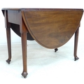 A 19th century Cuban mahogany drop leaf table, raised on cabriole legs with pad feet, 100 by 56 by 7... 