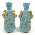A pair of Royal Crown Derby vases, late 19th century, of tapering form with applied gold panther han... 