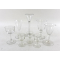 A collection of Georgian and later glasses including ale, wine and cordial glasses, several with fol... 