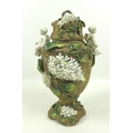 A late 19th century Continental porcelain vase and cover, of baluster form with applied gold mesh de... 