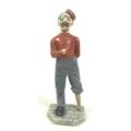 A Royal Worcester porcelain figurine, circa 1900, modelled as After War, with blue / grey and red un... 